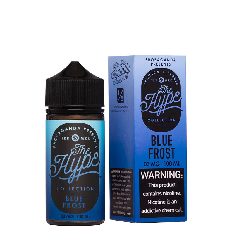 A 100ml bottle of Blue Frost Propaganda The Hype eLiquid and a box with a warning sign next to it - Vaper Corner