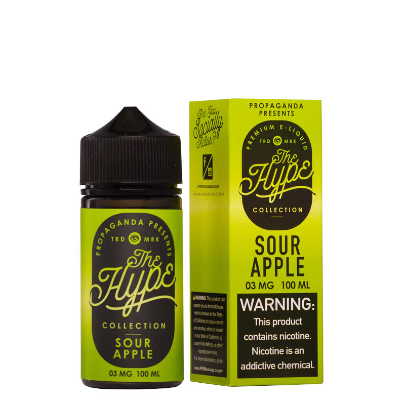 A 100ml bottle of Sour Apple Dust Propaganda The Hype eLiquid and a box with a warning sign next to it - Vaper Corner