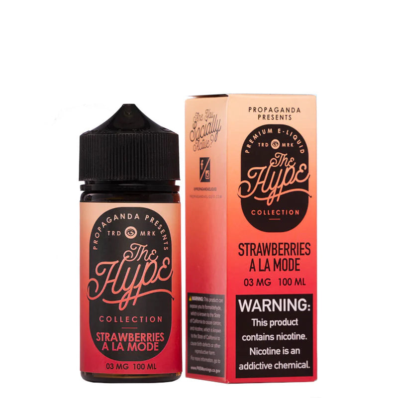 A 100ml bottle of Strawberries A La Mode Propaganda The Hype eLiquid and a box with a warning sign next to it - Vaper Corner